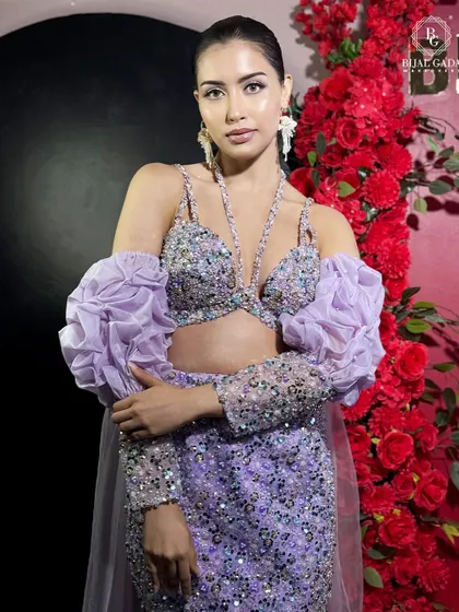 This bride looks like a modern goddess in her lilac gown. The intricate crystal work on the bodice is the centerpiece, complemented by a sleek, polished makeup look.