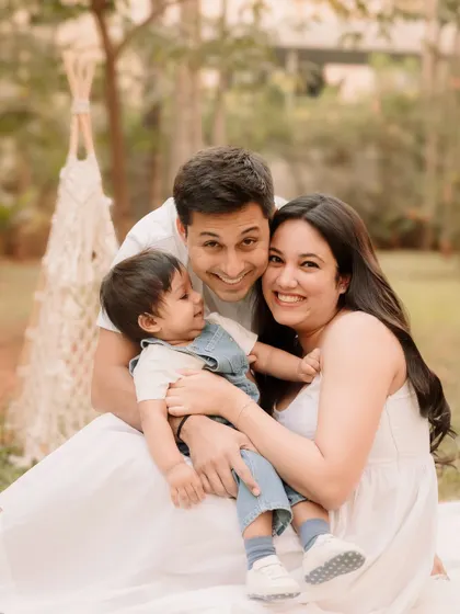 A sweet family hug, with everyone close together and smiling.