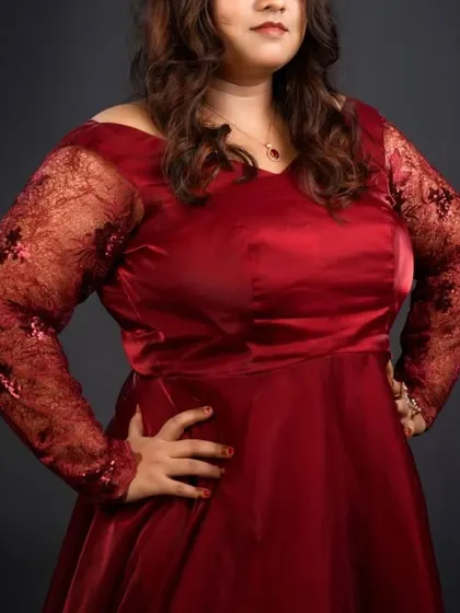 My outfits are size-inclusive. This beautiful maroon off-shoulder gown with sequined lace sleeves is designed to flatter your curves and make you feel confident.