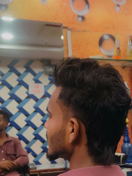 Another view of the textured mullet, showing how the hair on top has a messier, more casual look compared to a classic pompadour.
