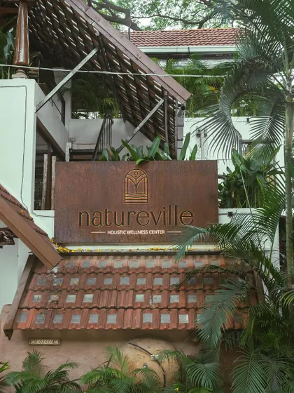 Our new sign for Natureville Holistic Wellness Center. We are dedicated to introducing the innovative concept of whole, unrefined plant-based foods and offering a diverse range of healing services to the Bangalore community.