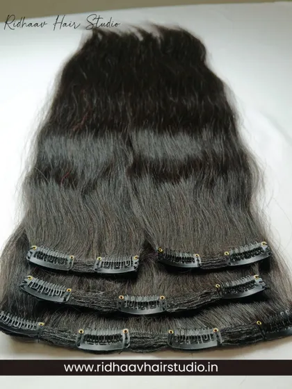 A full view of our 4-piece straight clip-in extension set. Made from 100% human hair, these extensions are silky, smooth, and perfect for achieving a sleek, long hairstyle in minutes.
