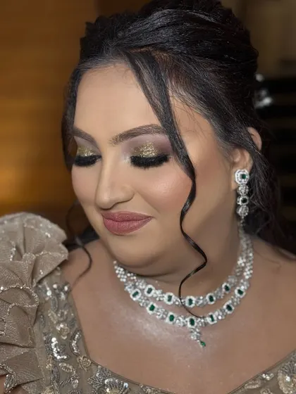 Another view of the stunning eye makeup. The winged liner and full lashes add drama, while the soft blending keeps the look sophisticated and perfect for a formal reception.
