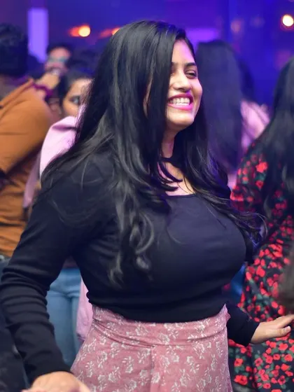 A smiling face in the crowd at Hydra.