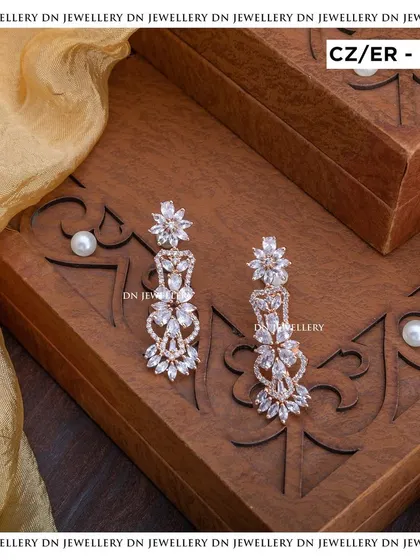 These rose-gold plated CZ earrings with a floral design are so delicate and pretty. They are perfect for adding a touch of sparkle to any look.