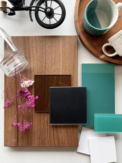 The mood board for our 'Eleganza' series, showing a sophisticated mix of wood, teal glass, and metallic accents.