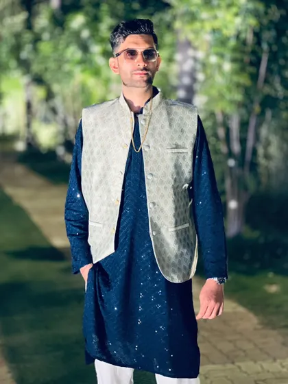 A confident pose in a classic ethnic ensemble. I believe in carrying myself with style and sophistication at every event.