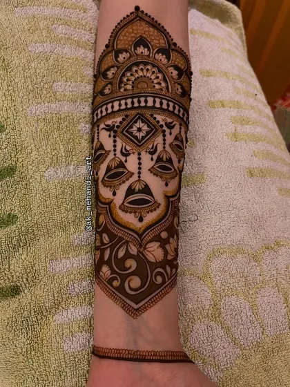 The full view of the arm band with hanging bells, creating a beautiful and unique piece of jewelry-like art.