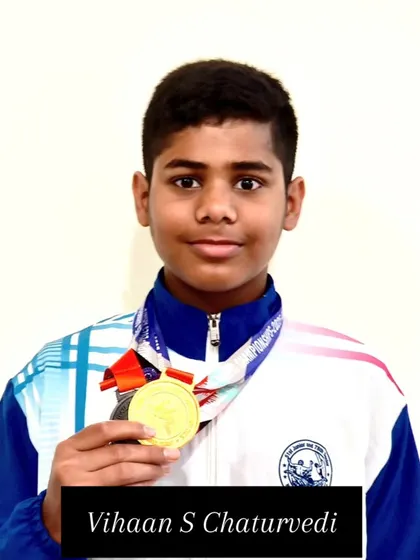 Vihaan S Chaturvedi with his gold medal from the freestyle relay.