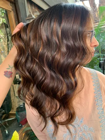 A side view of the beautiful bridal hair. The soft waves and rich color are a perfect combination. (No filter)