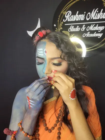 A close-up showing the intricate details, like the bindi, nose ring, and the blending of colors on the face.