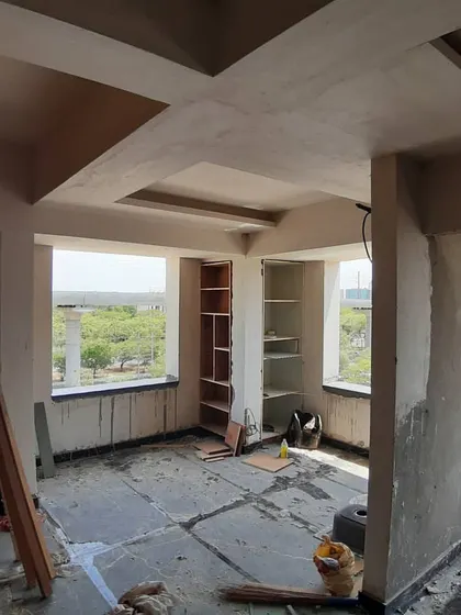 A room with a view, even during construction. The false ceiling framework is up, and the built-in shelving is taking shape.