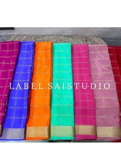 A look at the vibrant colors available in our pure Mysore crepe silk collection. These sarees are perfect for any festival, with traditional check patterns and a thickness of 120 to 140 GSM for a beautiful drape.