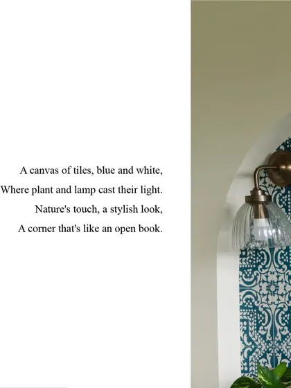 A canvas of tiles, blue and white, where plant and lamp cast their light. This corner is a stylish nook that feels like an open book.