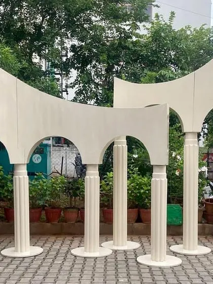 This image shows the full set of our fluted pillars and wavy panel backdrops before customization. The modular design allows for various configurations to fit different venue sizes and event styles.