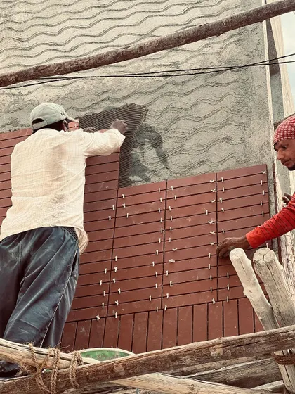 The process of installing terracotta cladding on a residence. Our team ensures precise spacing and alignment to create a flawless, textured facade.