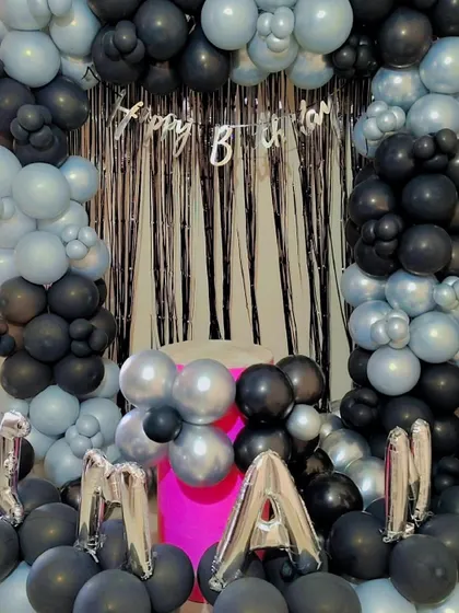 A closer look at the "MANAN" birthday setup with its modern color combination.