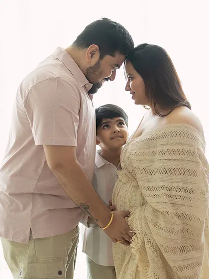 There is a sacred stillness when a family pauses to listen. Here, a big brother-to-be looks up with wonder as his parents share a quiet moment, their heads bowed together in love and anticipation. These natural light family maternity sessions are about capturing the connections that are already there.