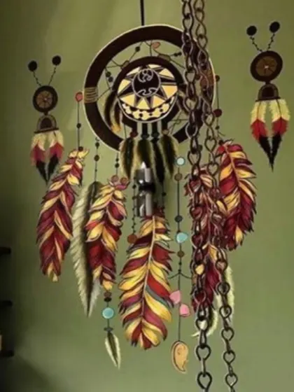 A closer look at the painted dreamcatcher. The detail in the feathers and the illusion of the hanging chains make this a truly special and eye-catching piece.