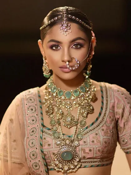 A close-up of a modern bridal look with a pop of purple under the eye. This shows how to add a subtle, trendy element to a classic look, a skill that Gen-Z brides often appreciate.