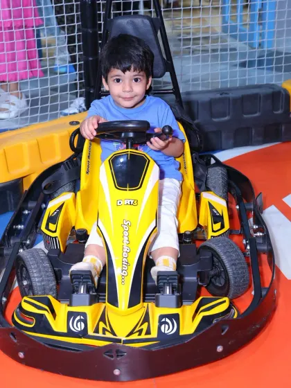 Another happy customer ready to put the pedal to the metal in our safe and fun electric go-karts.