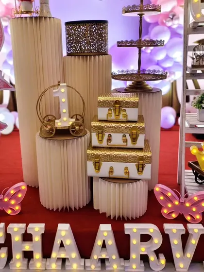 A close-up of the decor details, including light-up letters and butterfly props.