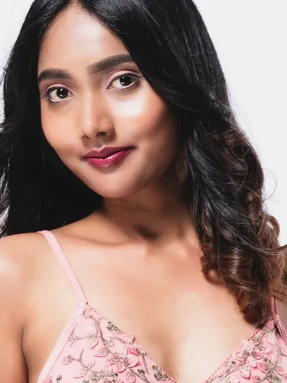 A close-up beauty shot with a direct and engaging gaze.