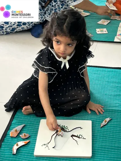 Another child works with a puzzle of a bird, learning about zoology through tactile exploration and problem-solving.