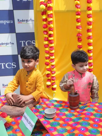 During our Baisakhi celebration, children explored traditional tools like the grinding stone. This hands-on experience connects them to the cultural roots of the harvest festival.
