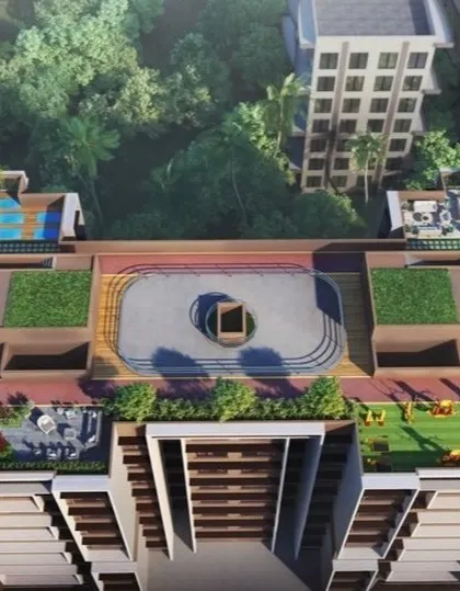 A top-down view of the apartment complex's rooftop, detailing the layout of the running track, green roofs, and recreational areas for residents.