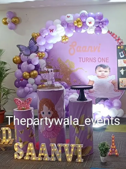 A fairy tale theme with a purple color palette and a personalized photo of the birthday girl.