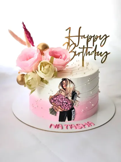 A classy and elegant cake for Natasha's birthday. The design features a pink and white ombre effect, decorated with fresh flowers and a stylish illustration of a girl holding a bouquet.