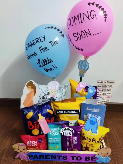 "Eagerly waiting for the little one!" This hamper expresses that excitement with custom balloons and a collection of healthy snacks like makhana and protein bars for the expecting parents.