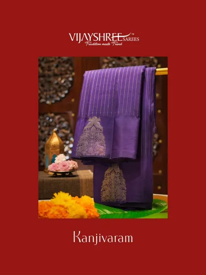 A rich purple Kanjivaram with large buttas and vertical zari lines.