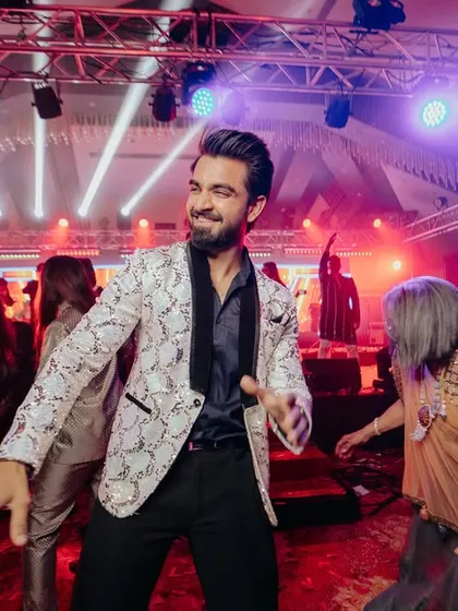In the middle of the dance floor, surrounded by happy guests. This is where I thrive, feeding off the crowd's energy and giving it right back.