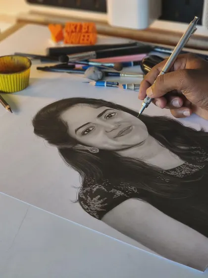My hand adding final touches to the portrait.