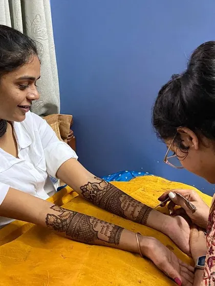 Another angle of the henna application in progress. I ensure my clients are comfortable throughout the hours-long session.