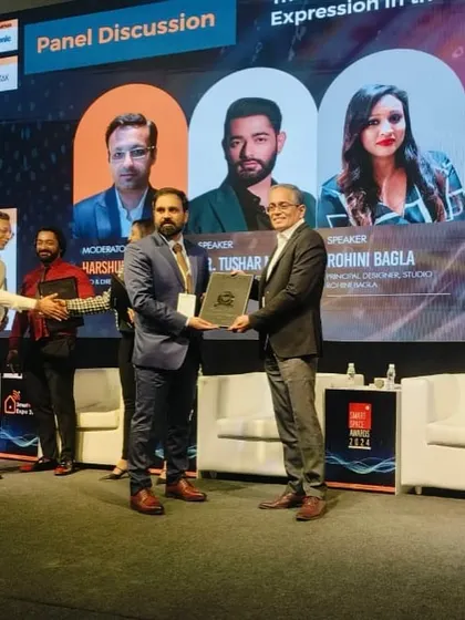 Our Managing Director presenting an award during a panel discussion at the Smart Home Expo. Our leadership plays an active role in celebrating and advancing the smart home industry.