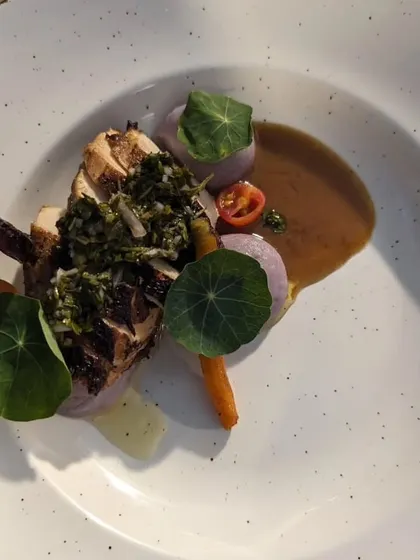 We believe in letting quality ingredients shine. This dish features roasted chicken with a vibrant flat-leaf parsley chimichurri, paired with seasonal organic vegetables sourced directly from our partner farms.