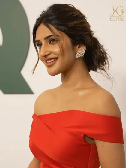 A radiant smile from Sreeleela, perfectly complemented by our sparkling diamond ear cuffs.