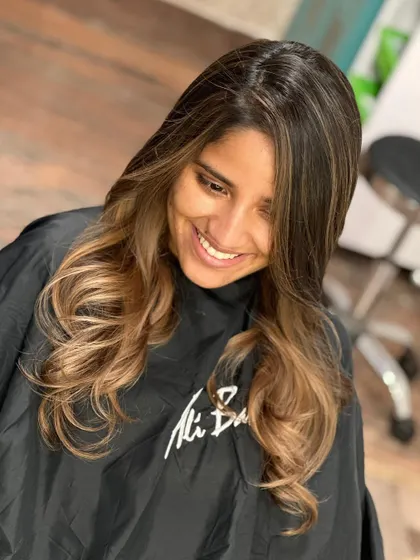 Hair transformation at its best. The smile says it all. This warm, honey-toned balayage is both glamorous and natural-looking.