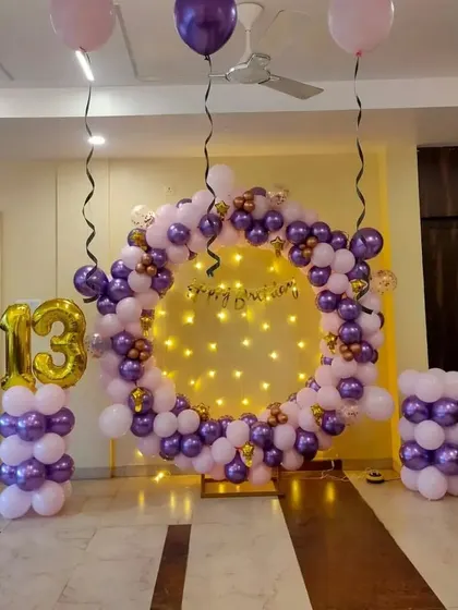 A full view of the 13th birthday ring setup in the party space.