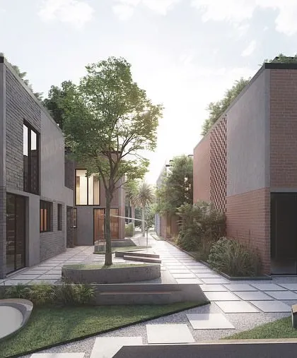 The community spaces in the Kolgaon Masterplan are designed as landscaped courtyards that weave between the houses. These shared green areas feature art, seating, and water elements to encourage social interaction.