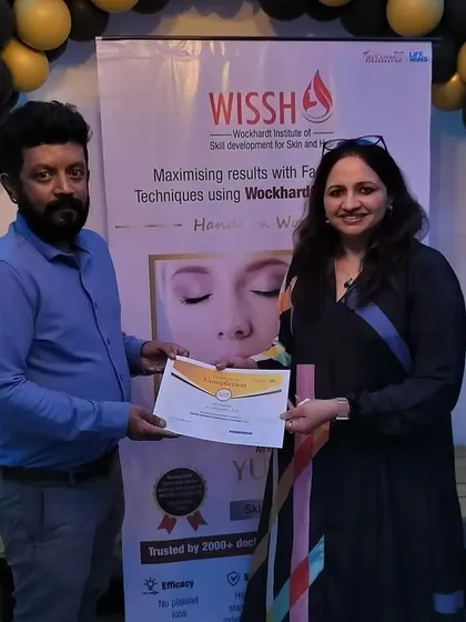 Another photo presenting a certificate at the hands-on workshop. My goal is to empower fellow practitioners and elevate the standards of care in facial aesthetics.