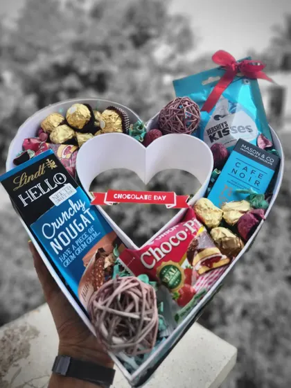Love is sweet in all its forms, especially chocolate. This heart shaped box is overflowing with a delicious assortment of chocolates like Lindt and Ferrero Rocher, making it the perfect indulgence for Chocolate Day.