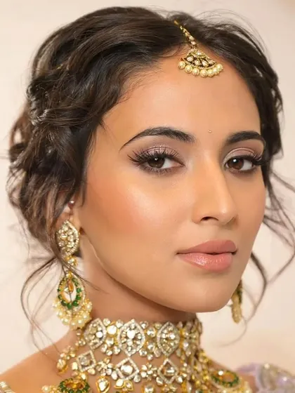 Another angle of the textured updo, showing how it looks from the front. It's a versatile style that beautifully showcases earrings and necklaces.