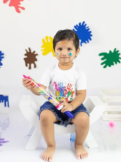 A sweet portrait with a little color on his cheek. I use only baby-safe materials to ensure these festive shoots are completely worry-free for parents.