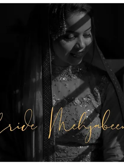 A duplicate of a black and white portrait with elegant text, capturing the bride's serene beauty in a classic, moody style.