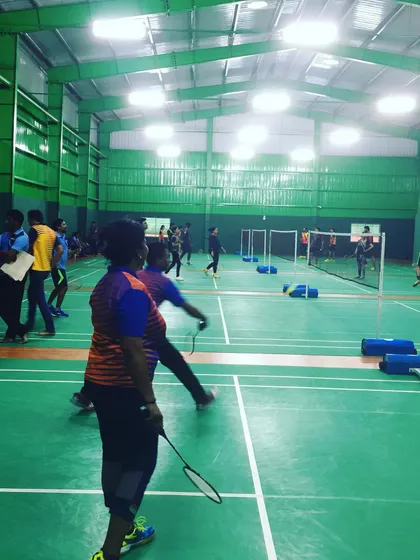 Spectators and players watch the action from the sidelines. The layout of my academy allows for both active participation and comfortable viewing for those waiting for their turn.