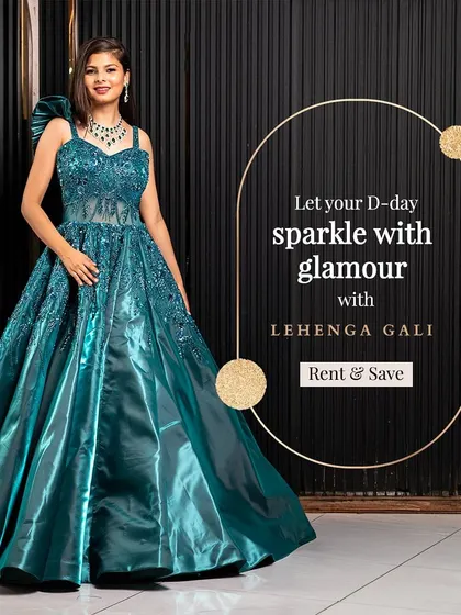 Let your D-day sparkle with this teal green sequined ball gown. The structured bodice and dramatic shoulder detail make it a high-fashion choice for a sangeet or cocktail night.